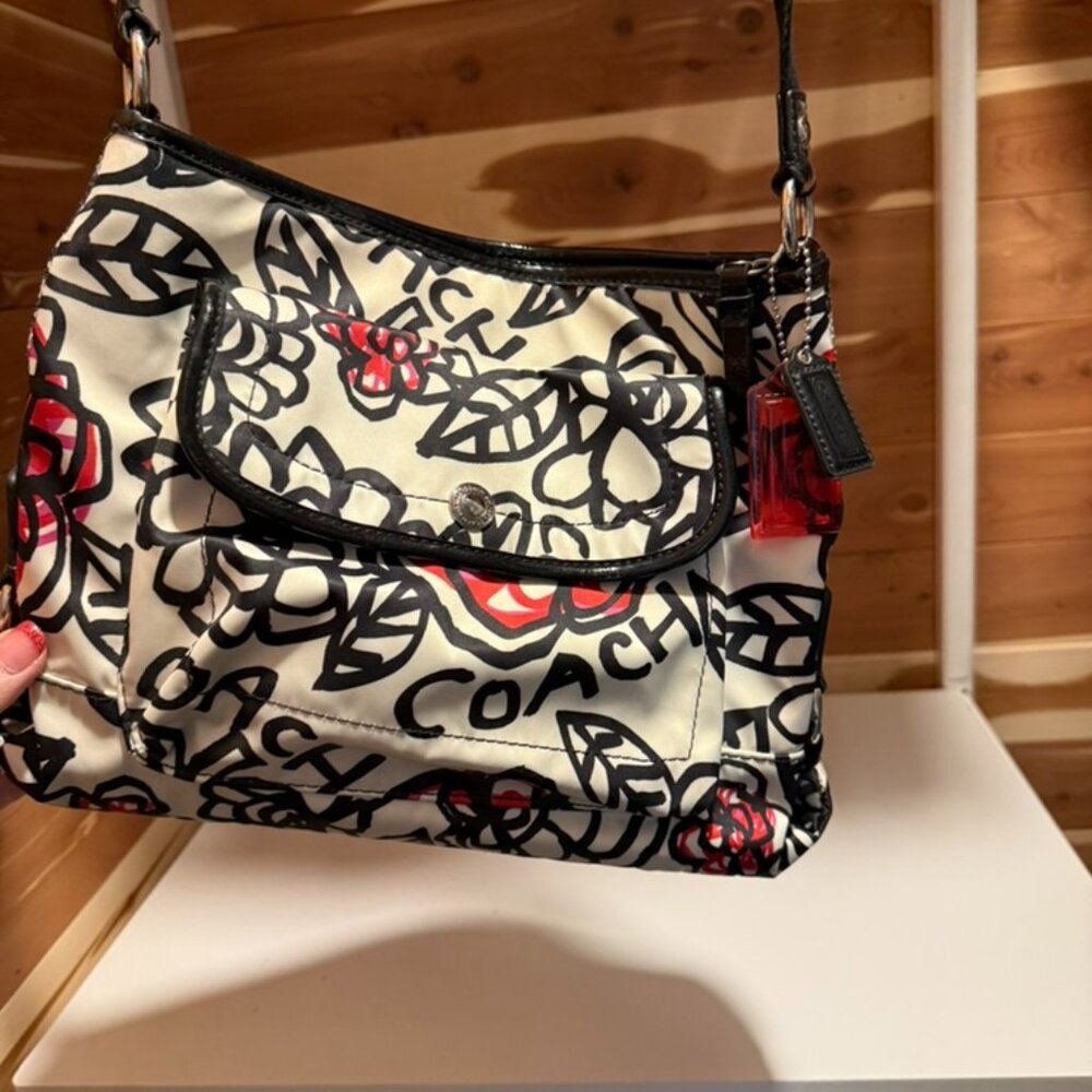 Authentic Coach shoulder bag (roomy medium size) with a white background